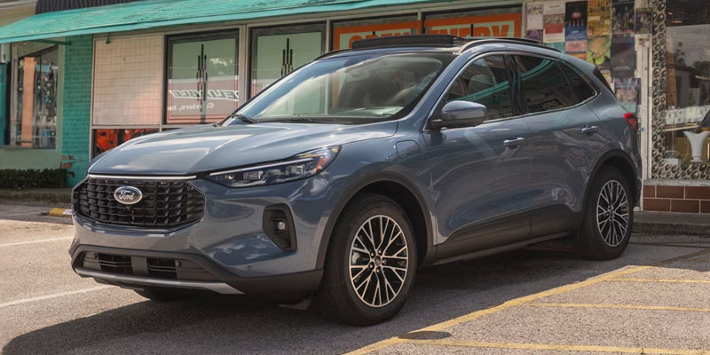 a blue 2026 Ford Escape SUV is parked in a parking space in front of a store front near Belleville, IL