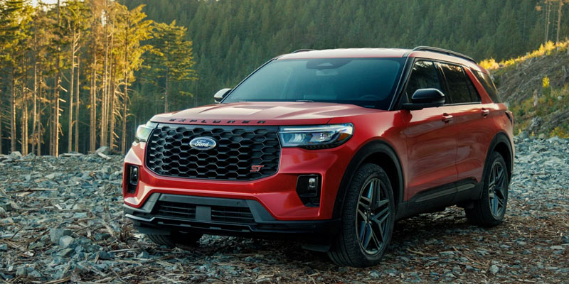 Red Ford Explorer in Forest