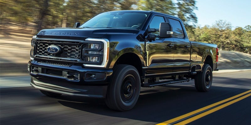 An image of the 2024 Ford F-250 driving on the highway